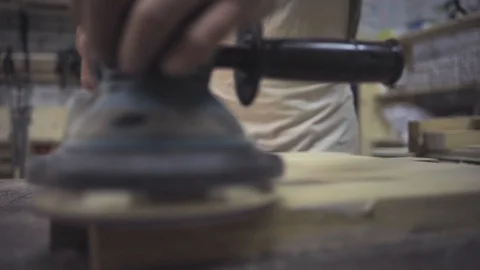 Man is craft working at a work bench with power tools Stock Footage 102902694