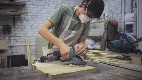 Man is craft working at a work bench with power tools Stock Footage 102902790