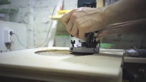 Man is craft working at a work bench with power tools Stock Footage 102902859