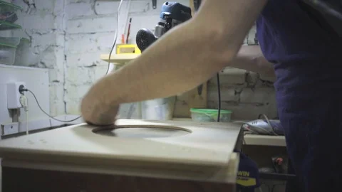 Man is craft working at a work bench with power tools Stock Footage 102902903