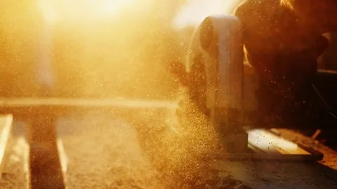 Man is craft working at a work bench with power tools in slow motion during Stock-Footage 108616239