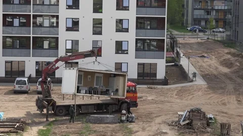 Man with crane raise constructional booth on truck. 4K Stock Footage 54628908
