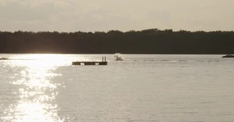 Man crashes wake boarding - slow motion Stock Footage 80855149