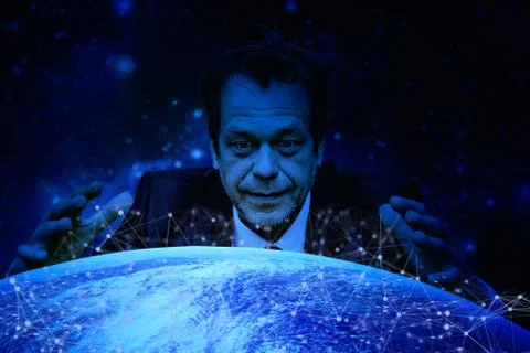 A man with a crazy look on his face was inclined over the globe spreading Stock-Fotos