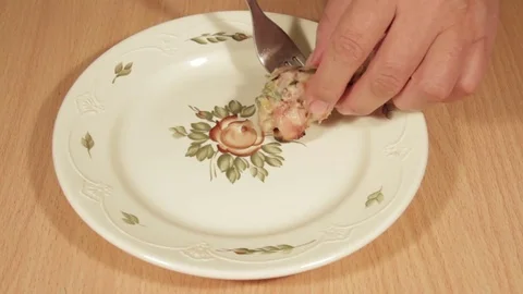 Man creates dishes portion from chicken wings Stock Footage 70993756