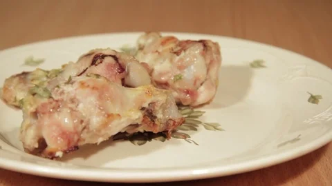 Man creates dishes portion from chicken wings with vegetables Stock Footage 71016554