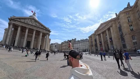 Man creating a 360 degrees video in front of the Panthéon in Paris, France Stock Footage 328707442