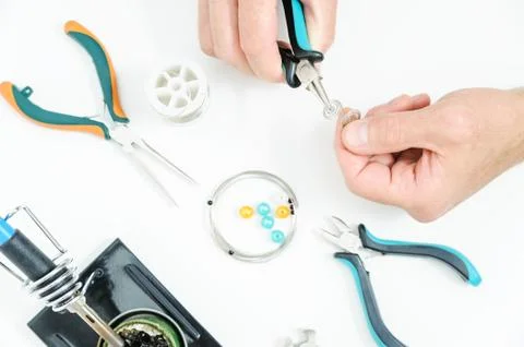 A man is  creating an ornament. Stock Photos