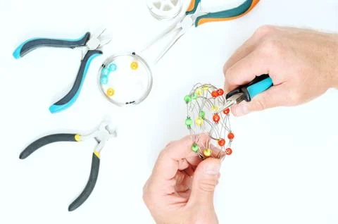 A man is  creating an ornament. Stock Photos