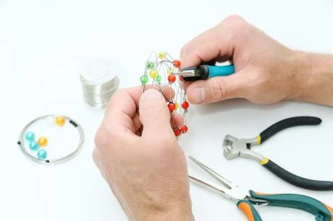A man is  creating an ornament. Stock Photos