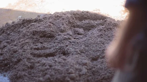 Man creating soil blocks Stock Footage 94884121