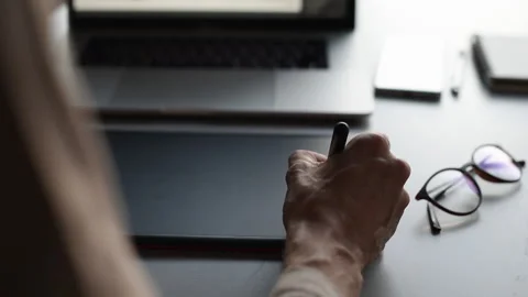 Man creative professional drawing drawing on graphics pen table Stock Footage 161728239