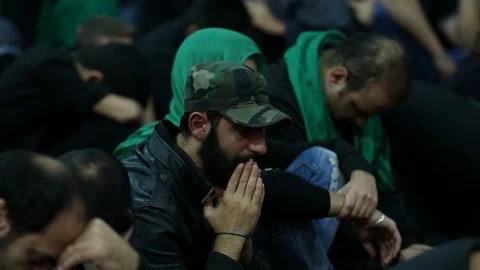 A man cries while listening to Hussein's calamity, Beirut Stock Footage 119955598