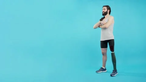 Man crossing arms standing with a prosthesis on his leg Stock Footage 233516108