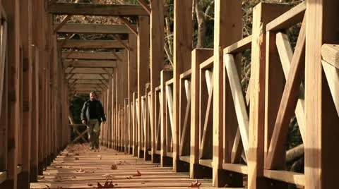 Man crossing at the bridge Stock Footage 12734042