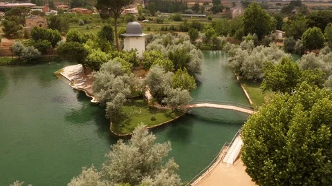 Man crossing bridge over thermal lake in Alhama de Aragón, Spain Stock Footage 98167416