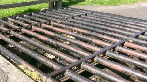 Man crossing cattle grid walking boots moving away Stock Footage 18420971