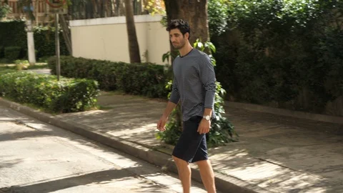 Man crossing road Stock Footage 89560288