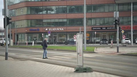 Man crossing the road Stockbeeldmateriaal 232482540