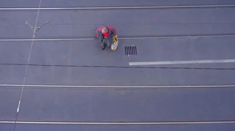 A man is crossing the road - view from above Stock Footage 56937541