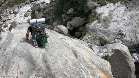 Man Crossing the Rock Bridge Stock Footage 124942494