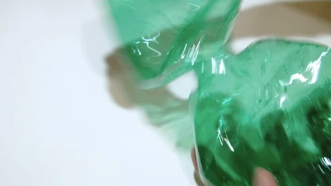 Man crushing plastic bottle for separate garbage collection,recycle concept Stock Footage 128548758