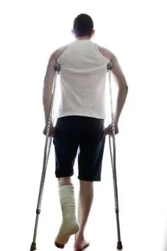 Man on crutches Stock Photos