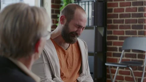 Man crying in front of psychologist because of addiction and depression at aa Stock Footage 165158194