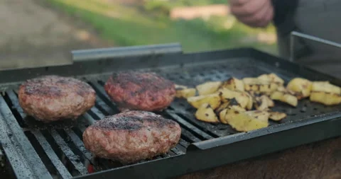 Man with Culinary Forceps Flips Cutlets of Minced Chicken. Grilling Food. Rest Stock Footage 132983424