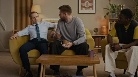 Man with Cup of Coffee Sharing Problems with Friends Stock Footage 335144333