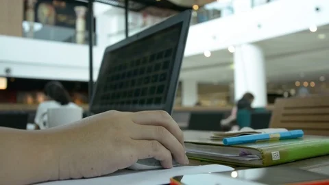 Man with a cup of coffee working on his laptop Stock Footage 83783425