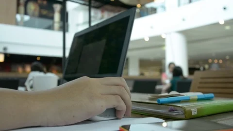 Man with a cup of coffee working on his laptop Stock Footage 83783518