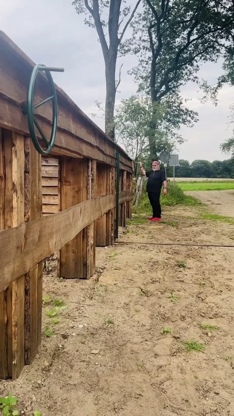 Man curious after the use for this gate Stock Footage 248831561