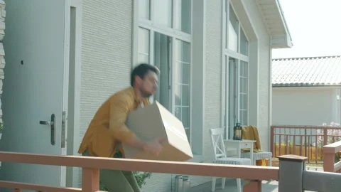 Man customer catching heavy boxes from deliveryman then taking parcels home Stock Footage 157301805