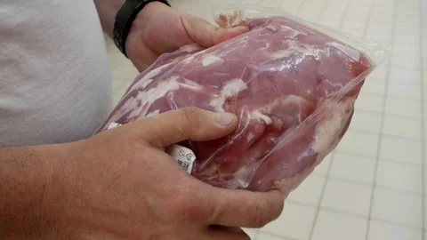 Man customer purchasing packaged meat in Supermarket Store Stock Footage 278085439