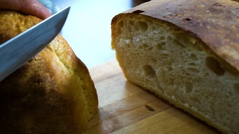 Man cut bread on table Video stock 106019291