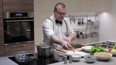 The man cut the fish into steaks Stock Footage 62744029