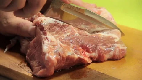 Man cut fresh meat Stock Footage 76527227