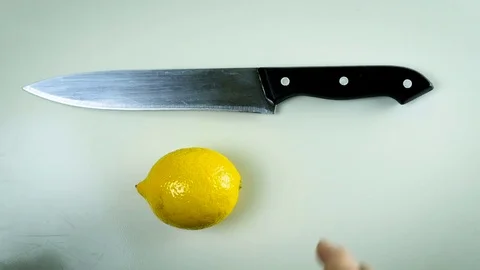 Man cut lemon slice Stock Footage 74657518