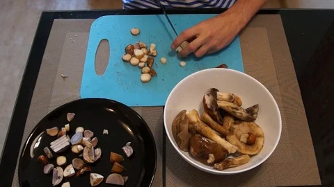 Man cut mushrooms Stock Footage 80189738
