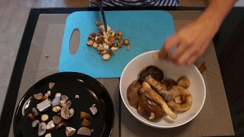Man cut mushrooms Stock Footage 80213432