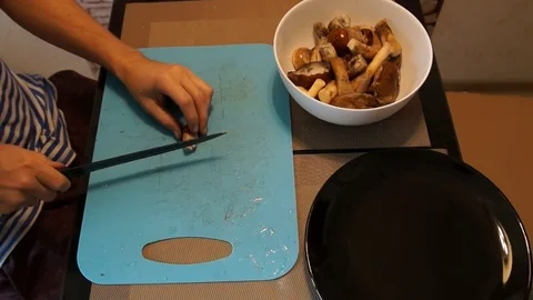 Man cut mushrooms Stock Footage 80213557