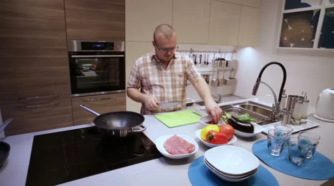 Man Cut the Sausage on the Board Stock Footage 63655322