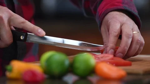 Man cuting tomatoes Stock Footage 70336754