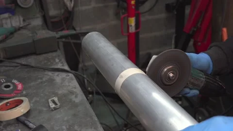 The man cuts the air intake pipe Stockbeeldmateriaal 135826325