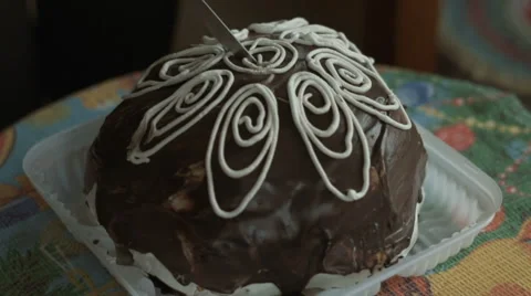 Man cuts biscuit cake Stock Footage 68392147