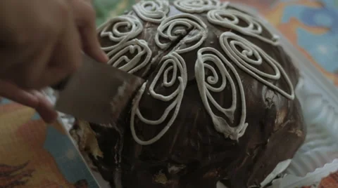 Man cuts biscuit cake Stock Footage 68392284