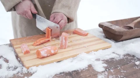 Man cuts carrots in the cold Stock Footage 168352285