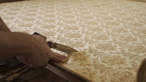 Man cuts fabric with scissors Stock Footage 128368443