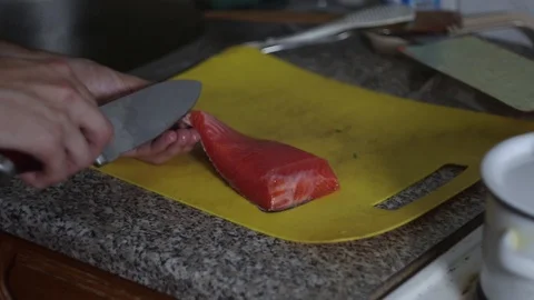 Man cuts a fish Stock Footage 118069224